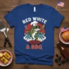 Red White & BBQ t-shirt with a cartoon bass wearing a chef hat and sunglasses holding a spatula and corn