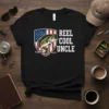 Black t-shirt with "REEL COOL UNCLE" text and a bass fish jumping in front of an American flag shield graphic