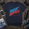 Navy t-shirt with "REFIT REFRED" in bold blue and red lettering, divided by a white line, within a red and