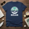 Navy t-shirt with "RELAX" text and a graphic of a person in a hammock between two palm trees on a