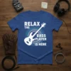 White text and graphic of a bass guitar on a blue t-shirt that says "RELAX THE BASS PLAYER IS HERE"