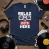 Navy blue t-shirt with "RELAX THE DJ'S HERE" text and a graphic of DJ turntables