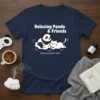 Relaxing Panda & Friends t-shirt design featuring a panda and cat on a cloud, with text and social handle