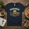 Remember The Sabbath To Keep It Holy Exodus 20:8 T-Shirt with lotus flower graphic and vintage text