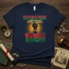 Reparations Overdue Since 1865 t-shirt with black fist and chain graphic, featuring Pan-African colors