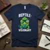 Reptile Visionary t-shirt with a green cartoon chameleon wearing glasses and sticking out its blue tongue