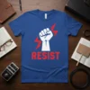 RESIST fist graphic with red lightning bolts on a blue t-shirt, symbolizing activism and empowerment