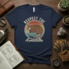 Retro graphic t-shirt with the text "RESPECT THE Armadillo" above and below a vintage-style armadillo illustration