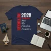 Navy blue t-shirt with "RETIRED 2020 Not My Problem Anymore" text in white and red distressed font