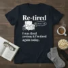 Retired t-shirt design with text "I was tired yesteay & I'm tired again today" and a graphic of a comfy