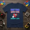Retro Game Over Insert Life t-shirt design featuring pixelated heart, I-UP mushroom, and hand cursor