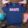 Blue t-shirt with "SKATE" in bold white and pink letters, featuring a roller skate graphic