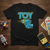 Black t-shirt with blue and yellow "TOY" text and a blue toy gun graphic, 80s retro style