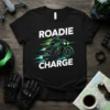 Black t-shirt with "ROADIE CHARGE" text and a graphic of a green motorcycle rider in motion