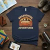 Roadschool Adventures text with a vintage van and mountains graphic on a navy blue t-shirt
