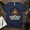 Roar Into Success t-shirt with a fierce lion graphic and bold typography, motivational design