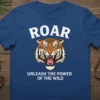 Roar Unleash the Power of the Wild tiger graphic t-shirt design in white text with a fierce tiger illustration