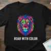 Roar With Color text with a vibrant, geometric lion head graphic on a black t-shirt