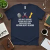 Rock Beats Scissors Nothing Beats Reading quote on a navy t-shirt, featuring rock, scissors, paper icons and a diploma scroll
