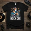 Black t-shirt with "ROCK ON!" text and a cartoon corgi playing an electric guitar, surrounded by amplifiers and musical notes