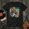 Black t-shirt with a fierce lion playing an electric guitar, text says "ROCK ON!", vibrant retro background