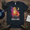 Rock Owl t-shirt design featuring a golden owl perched on a rock with a geometric background and crescent moon