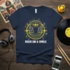 Rock On & Smile graphic tee with yellow headphones, sound waves, and musical notes on a navy blue shirt