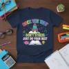 T-shirt with colorful text "ROCK THE TEST DON'T STRESS JUST DO YOUR BEST", rocket, open book, brain, and lightbulb graphic