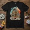 Rocket & Roll Trash Panda Crew t-shirt design featuring three raccoons peeking out of wooden crates with retro geometric background