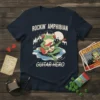 T-shirt design featuring a frog playing a guitar with "ROCKIN' AMPHIBIAN GUITAR HERO" text and a concert crowd background