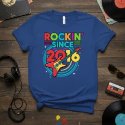 Blue t-shirt with colorful "ROCKIN' SINCE 2016" text and a red electric guitar graphic