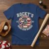 Rocky's Home Run Heroes vintage t-shirt design with a raccoon playing baseball, text and stripes