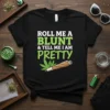 Black t-shirt with "Roll Me A Blunt & Tell Me I Am Pretty" text and cartoon blunt graphic