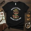 Black t-shirt with "Rooted & Patient Nature's Slow Sage" text and a graphic of a tortoise on mushrooms