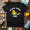 Black t-shirt with "Rubber Duckie Crew" text and a graphic of a captain duck leading ducklings in water