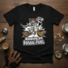 Running on Fossil Fuel T-Shirt with a T-Rex skeleton riding a bicycle towards a coffee cup