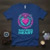 Sacred Heart T-Shirt design with a pink heart, crown, and arrows on a blue shirt