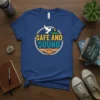 Safe and Sound t-shirt with a dove, moon, hills, and handshake design in a circle