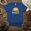 Sailhub t-shirt design featuring a white sailboat on blue water with an orange sunset, text says "Sailhub"