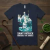 T-shirt design featuring Saint Patrick banishing snakes, with a castle and waves, text "SAINT PATRICK BANISHES THE SNAKES"