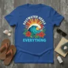 Saltwater Heals Everything t-shirt design featuring a vibrant ocean wave, sun, and tropical hibiscus flowers