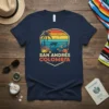 San Andrés Colombia text with a vintage sunset, palm tree, turtle, and coral reef graphic on a navy t-shirt