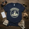 Vintage SANDBAGGER t-shirt design with a cartoon mole filling sandbags, cream outline on navy blue tee