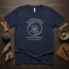 Navy t-shirt with "SANTOSHA CONTENTMENT Vipassana Meditation" text and a lotus flower graphic in a circle