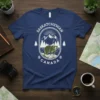 Saskatchewan Canada t-shirt design with a bear, mountains, pine trees, and sunburst in an oval frame