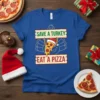 Save a Turkey Eat a Pizza funny holiday t-shirt design featuring a cartoon pizza slice in a Santa hat