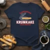 ScandinaNinan Krumkake Cookie Waffles text with graphic of a krumkake iron on a navy t-shirt