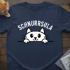 Navy blue t-shirt with white text "SCHNURRSULA" above a cute white cat peeking over a line