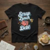 Black t-shirt with "Scrap Lunch Debt" text and a piggy bank graphic with gears, symbolizing financial freedom