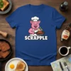 Scrapple t-shirt featuring a cartoon pig chef holding a frying pan with scrapple, text reads SCRAPPLE